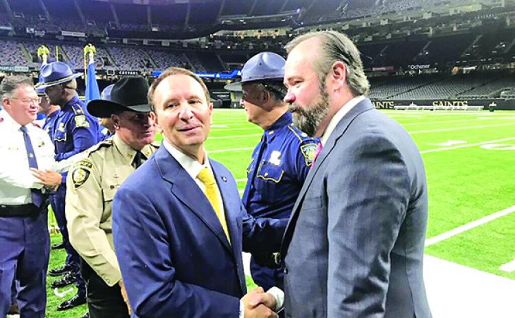 Gov.-elect Jeff Landry, left, shakes hands with Ed O’Callaghan, a former assistant U.S. attorney who will lead a review of Louisiana State Police practices and policy. Landry and Attorney General-elect Liz Murrill announced Wednesday, Nov. 29, 2023, at a Superdome news conference that O’Callaghan’s law firm will be hired to conduct the review. (Greg LaRose/Louisiana Illuminator)