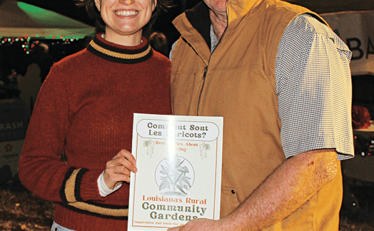 Jane Ainsley Rothschild, an Extension Support Specialist Seed to Supper Program Assistant Horticulture Section, from Cornell College of Agriculture and Life Sciences in Ithaca, New York, attended the Eunice Community Garden Christmas Festival. Rothschild wrote articles about community gardens in Louisiana. She is with Randy Miller, director of the Eunice Community Garden. (Photo by Myra Miller)