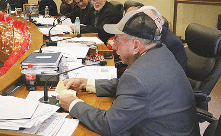 Evangeline Parish Police Juror from District 2 Sidney Fontenot reads the engineer’s report en français for parish engineer Ronnie Landreneau during the French meeting held Dec. 12. (Ville Platte Gazette photo by Tony Marks)