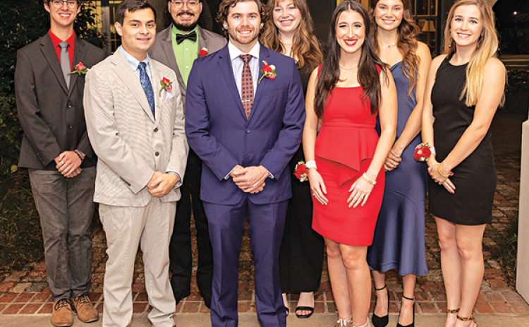 The University of Louisiana at Lafayette’s Fall 2021 Outstanding Graduates are, from left: Wade Johnson, College of Liberal Arts; Jase Mayorga, College of Engineering; Noe Fernandez, University College; Overall Outstanding Graduate Tyler Francis, B.I. Moody III College of Business Administration; Grace Marks, College of the Arts; Taylor Montoucet, College of Nursing and Allied Health Professions; Bailey Austin, College of Education; and Sydney Boudreaux, Ray P. Authement College of Sciences. (Photo by Rache