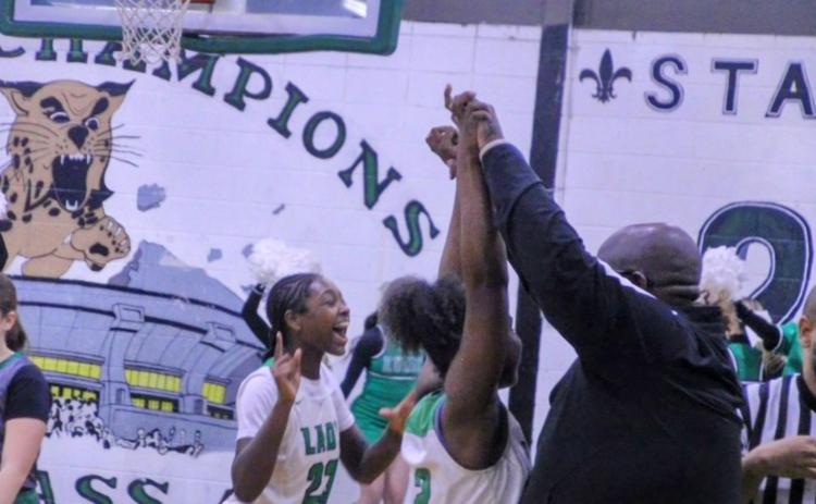 The Eunice Lady Cats celebrate a hard earned 39-35 win over Mamou last Friday evening. (Photo by Sports Editor Rhett Manuel)