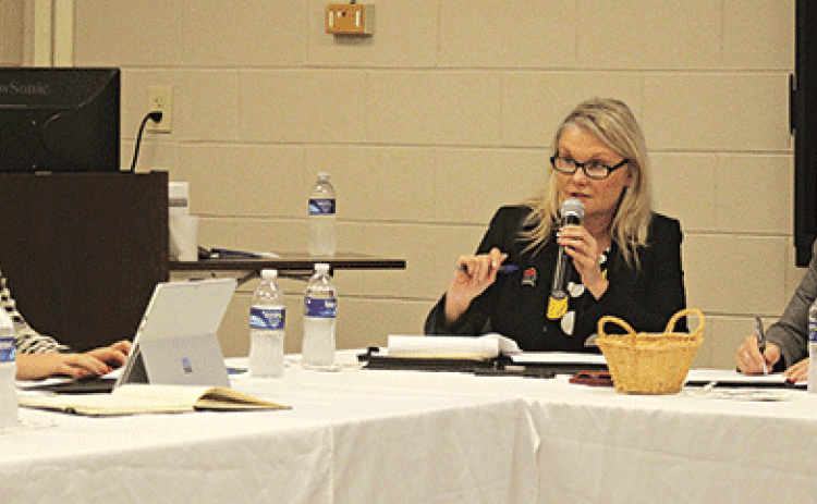 Newly elected president of the Evangeline Economic Development Authority, Opal Andrus, is in the center as she presides over the inaugural meeting on Monday, Dec. 16. At left, is newly elected secretary Raquel Manuel and, on the right is acting secretary Dr. Gwen Fontenot. (Ville Gazette photo by Tony Marks)
