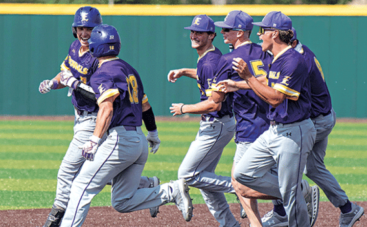 Tyson LeBlanc, left, is met by teammates after driving in the game-winning run against Delgado CC on Sunday as LSUE .Baseball continued its 2025 trend of late game theatrics, winning their regular season finale 6-5 against Delgado CC in extra inning walk-off fashion on Sunday. LeBlanc capped off his sophomore season with a walk-off winner in the final home game of the season. (LSUE photo)