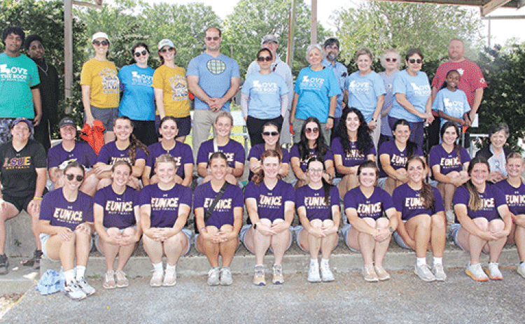 Some of the 248 volunteers who spread across Eunice on Saturday gathered for a photo in front of the Eunice Municipal Complex. The cleanup was part of Love the Boot in Louisiana. The local cleanup was organized by Keep Eunice Beautiful. The crew in front are members of the LSUE softball team. (Photo by Harlan Kirgan)