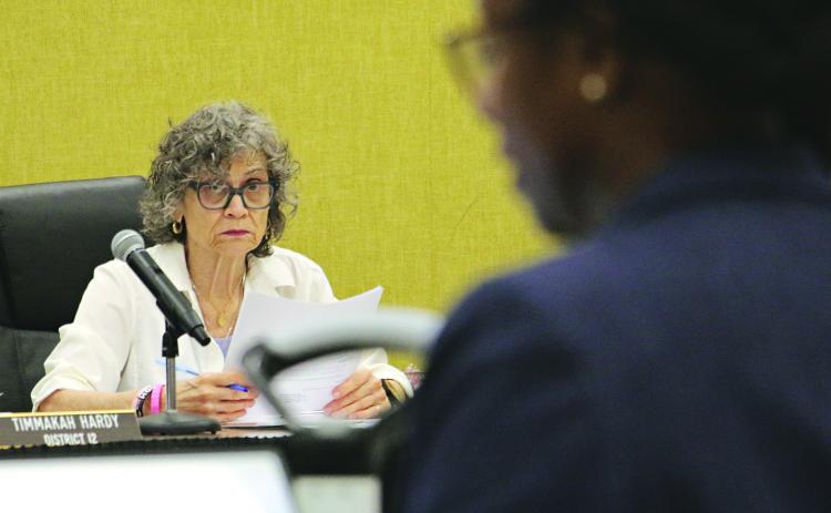 St. Landry Parish School Board member Mary Ellen Donatto listens to the budget presentation by Shaun Grantham, chief financial officer, at a Committee of the Whole meeting on Monday. (Photo by Harlan Kirgan)