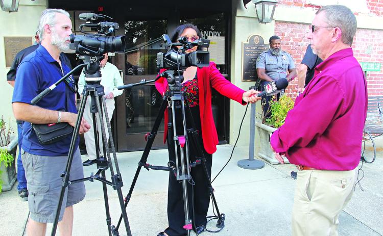 St. Landry Parish President Jessie Bellard, right, speaks to reporters after a special Parish Council meeting Tuesday in Opelousas. (Photo by Harlan Kirgan)