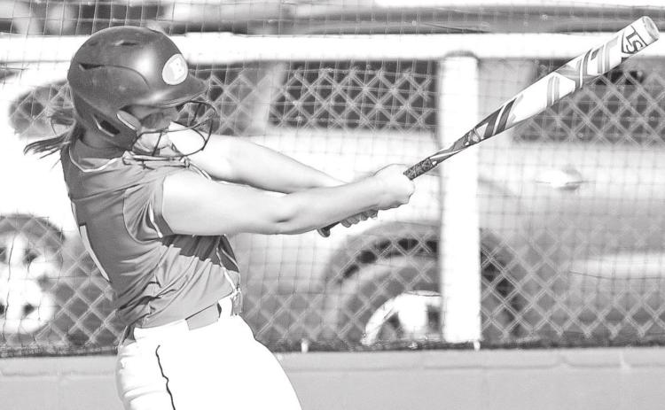 Eunice High’s Alexis Ortego blasts a three-run home run against Eleanor McMain.