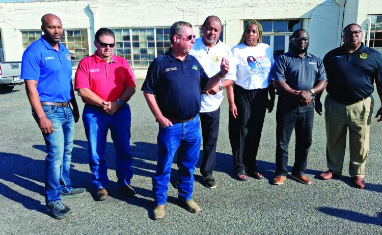 Bellard speaks at a press conference on Wednesday