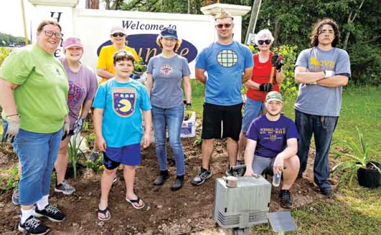 On Saturday, members of the Eunice Bulb and Blossom Garden Club added plantings around the Welcome to Eunice sign located on the west end of Laurel Avenue after giving the sign a thorough cleaning. The beautification project coincided with Saturday’s Citywide Cleanup organized by Keep Eunice Beautiful as the culminating activity of the statewide Love the Book Week. Earlier in the week, club members prepared the area Saturday’s planting. From left are club president April DeRouen, Jacquelyn Love with Levi Lo