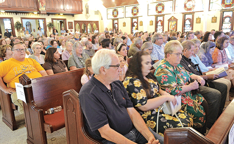 By the time the rosary began prior to the 64th anniversary Mass for Charlene Richard, “The Little Cajun Saint,” every seat in St. Edward Catholic Church in Richard was filled. The annual Mass was celebrated Aug. 11 the anniversary of Richard’s death. (Photo by Claudette Olivier/ Crowley Post-Signal)