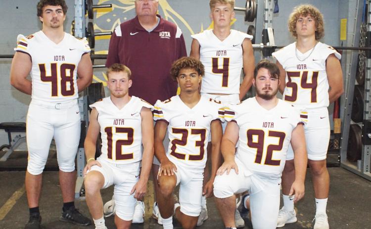 Iota top returning defensive starters kneeling from left, are Christian Beasley, Bryson Allison and Brock Keltner. Standing, from left, are Trevor Ruffner, coach Ray Aucoin, Blayton Fontenot and Scott Jackson. (Photo by Charles Sexton)