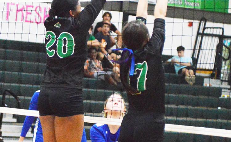 Eunice High’s Gabby Mitchell blocks a shot from St. Edmund as Maci Vincent assists on the play. (Photo by Tom Dodge)