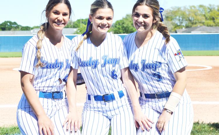 St. Edmund’s Rylie Johnson, Karleigh Soileau and Kennedy Ardoin finished their high school soffball careers Wednesay in the regional round of the playoffs. (Photo by Tom Dodge)
