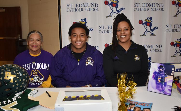 Kieran Davis returned to St. Edmund where he signed to play football for East Carolina. From left, are, grandmother Velma Davis, Kieran, and his mother, Lena Davis. (Photo by Tom Dodge)