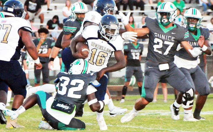 Eunice High’s Nicholas Gabriels tackles Avoyelles running back Decareyn Sampson.