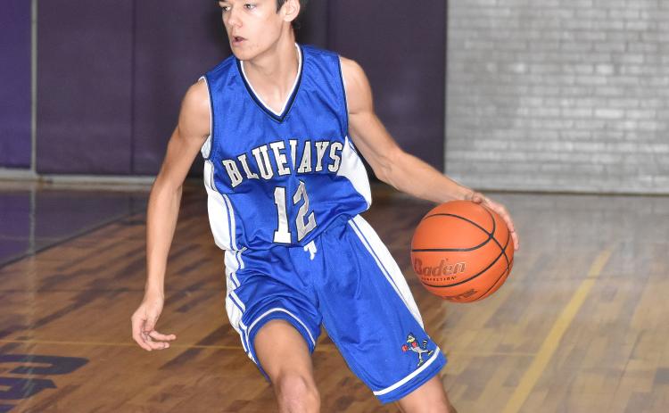 St.. Edmund’s John Landry scored 20 points against False River Academy. Landry also scored 13 points against Opelousas Catholic and 12 points against Catholic High of Pointe Coupee to earn the Eunice News Player of the Week honors. (Photo by Tom Dodge)