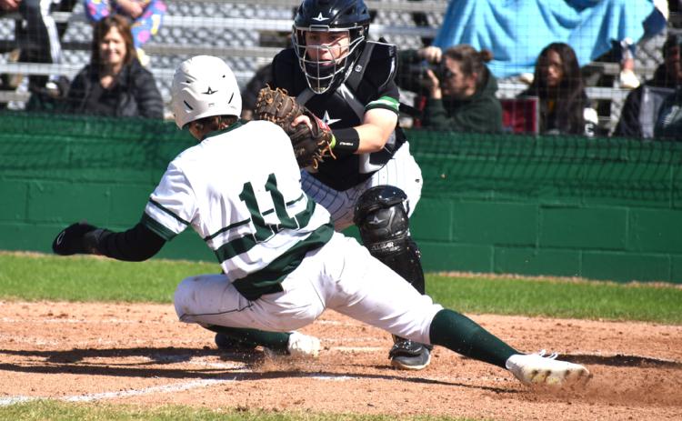 Eunice High catcher Payton Brown tags out Mamou’s Brady Fontenot during the Perry Pitre Ford jamboree.