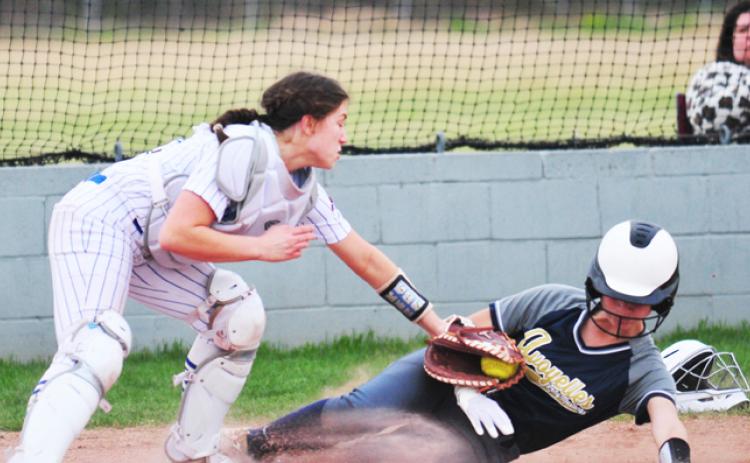 Alice Brown makes a tag at the plate.