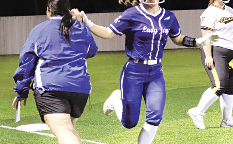 Beth Miller getting a high five from Coach Nicole Lanthier as she rounds third base after hitting a home run.  (Photo by Amy Myers)
