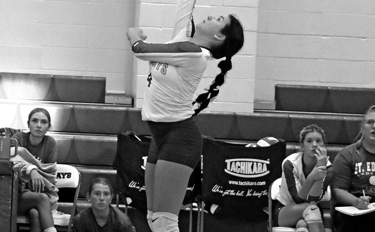 St. Edmund High School volleyball player Halle Cart sends the ball over the net during a recent game. The volleyball team won three sets in a row, 25-14, 25-17, and 25-17. (Photo by Amy Myers)