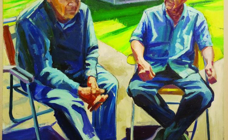 Guys sitting painting