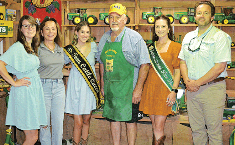 Kelly’s Landing was the setting Tuesday night for a meeting of LSUE officials and local and area agriculture teachers and stakeholders to discuss the Sustaining Future Farms in Louisiana program at the university. Among those on hand were, from left, Caitlin deNux, program manager; Dr. Nancee Sorenson, chancellor; Gracie Bourque, Abbeville Cattle Festival Teen Cattle Queen; Kelly Hundley, host; Sadie Zaunbrecher, International Rice Festival Queen; and Rep, Phillip DeVillier. (Photo by Steve Bandy/Crowley Po