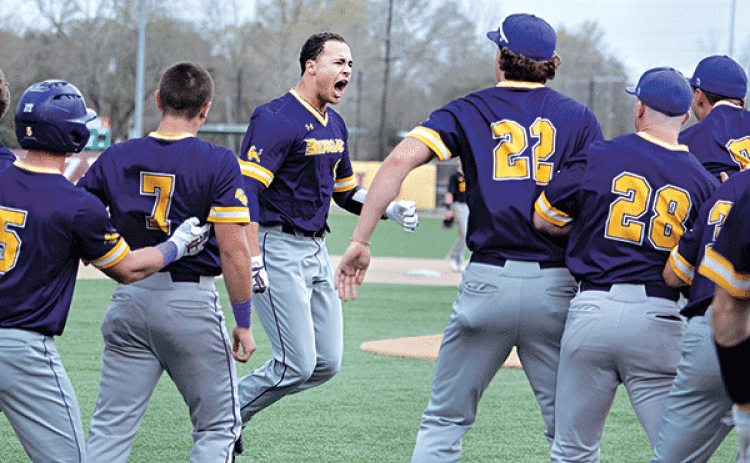 LSU Eunice celebrates with Cash Riley, center, after hitting the game winning grand slam vs. Tyler JC. (LSUE photo)