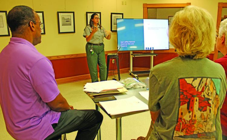 Laura McDonald, park ranger at the Prairie Acadian Cultural Center, gave a re-introduction of the center, which reopened around Mardi Gras earlier this year after being closed for about five years. During those years, the building was outfitted with a new air conditioning system and a new roof. (Photo by Claudette Olivier)