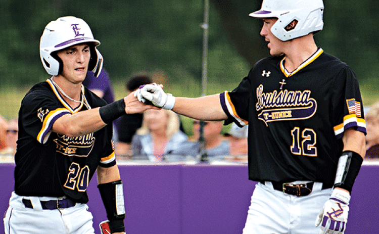 Will Mabry IV, right, congratulates Milan Obradovich after scoring an early run in LSUE’s win over Bossier Parish. (LSUE photo)