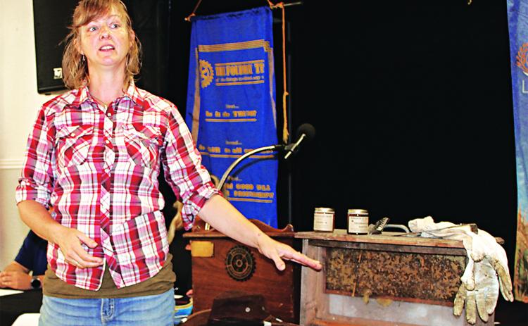 Rachael Clayton brought a “frame” of honeybees she recovered from a house in Gueydan when she spoke to the Rotary Club of Crowley recently about her experiences as Acadia Parish’s first 4-H Beekeeping Club sponsor. (Photo by Steve Bandy / Crowley Post-Signal)