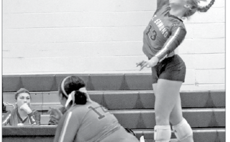 On Tuesday evening, the St. Edmund High volleyball team fell to Westminster Christian Academy Opelousas 15-25, 5-25, and 15-25. St. Ed senior Ava Smith goes for a spike during Tuesday’s loss to Westminster Christian Academy in district play. From left, are Reagan Gradney and Ava Smith. (Photo by Amy Myers)
