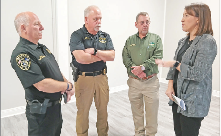 Eunice City Marshal Terry Darbonne, left, Eunice Police Chief Kyle LeBouef, St. Landry Parish President Jessie Bellard and Judge Laura Garcille talk during a press conference on Wednesday. A proposed nine-parish regional juvenile detention facility will be supported initially by a voter-approved 1-cent sales tax, Bellard said during the press conference.