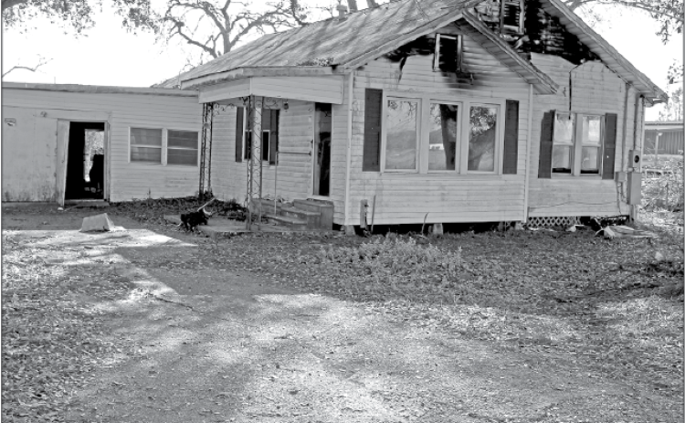 Eunice fire fighters were called to a structure fire at 152 East Ardoin at 4:14 p.m. Friday. According to Eunice Fire Chief Chaise Brown, “The home was unoccupied. It is located next door to Guillory Oil storage tanks.” The cause of the fire is under investigation. (Photo by Myra Miller)