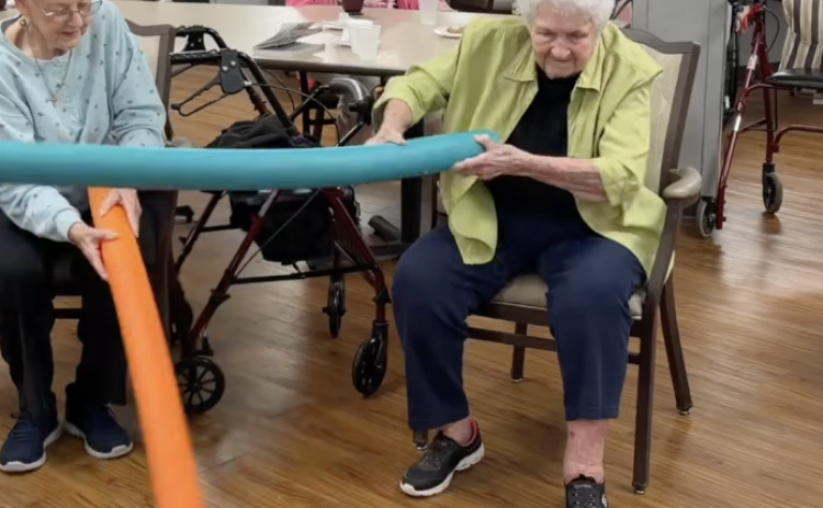 Eunice Manor house-guests playing noodle hockey