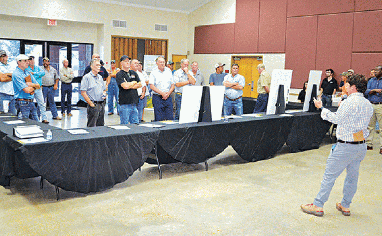 Andy Taylor, senior manager in development for Lightsource bp,addresses a larger-than-expected crowd of area farmers and citizens at the LSU AgCenter Building Wednesday concerning a proposed 1,100-acres solar farm to be located north of Crowley along La. 13. (Photos by Steve Bandy/Crowley Post-Signal)