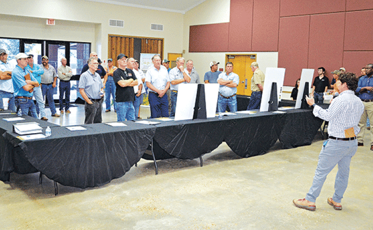 Andy Taylor, senior manager in development for Lightsource bp,addresses a larger-than-expected crowd of area farmers and citizens at the LSU AgCenter Building Wednesday concerning a proposed 1,100-acres solar farm to be located north of Crowley along La. 13. (Photos by Steve Bandy/Crowley Post-Signal)