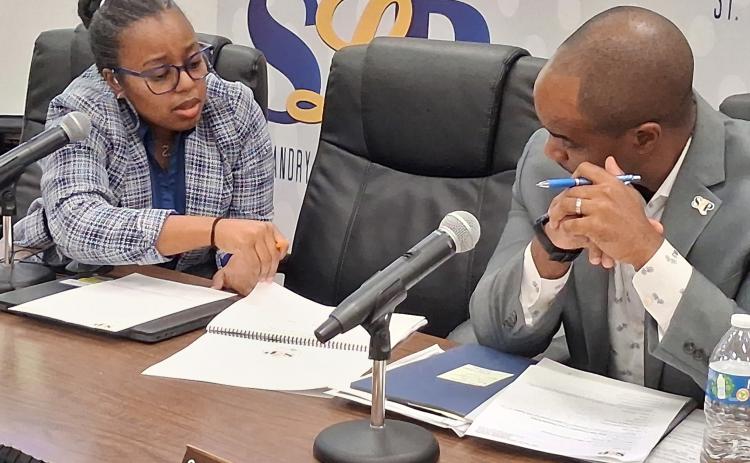 St. Landry Parish school board member Bianca Vedell poses budget questions to superintendent Milton Batiste III following the thursday night meeting