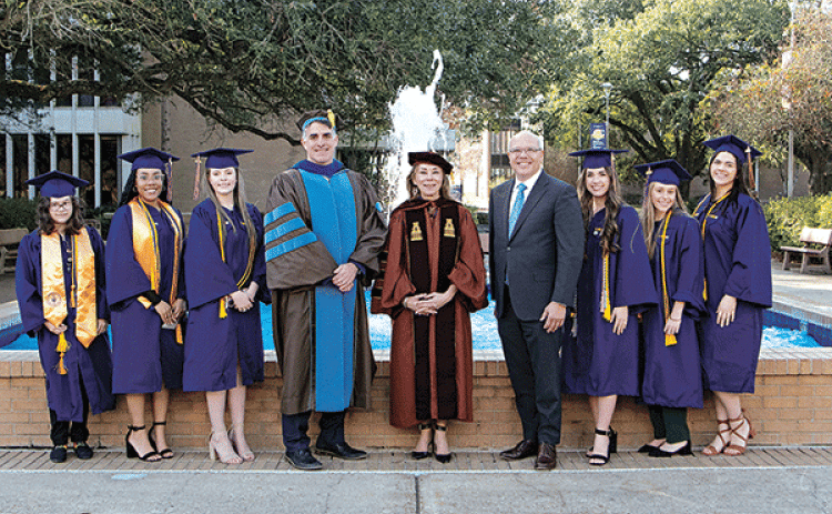 Summa cum laude, 3.8-4.0 GPA graduates, from left, are  Mya Velasquez; Jade Hickman; Nicole Thibodeaux; Dr. John Hamlin, LSU Eunice vice chancellor for academic affairs and provost; Dr. Nancee Sorenson, LSU Eunice chancellor; U.S. Eastern District Judge Darrel J. Papillion; Taylor Doughty; Abbie Delaune; and Destiny Allison. (Submitted photo)