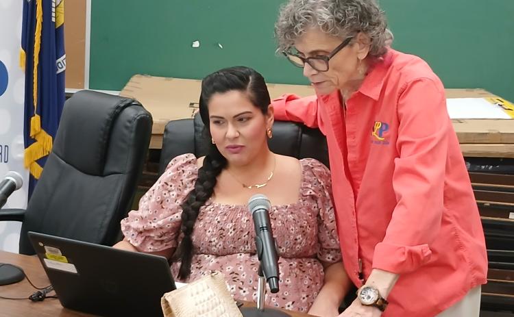 Tiffany Nolan and Mary Ellen Donatto look at the budget