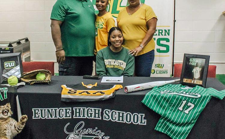Eunice High senior Gabby Mitchell, sitting, signed this week to play softball at Southeastern Louisiana University. Standing, from left, are her father, Ernest Mitchell III, sister, Madison Mitchell and mother, Patina Mitchell.