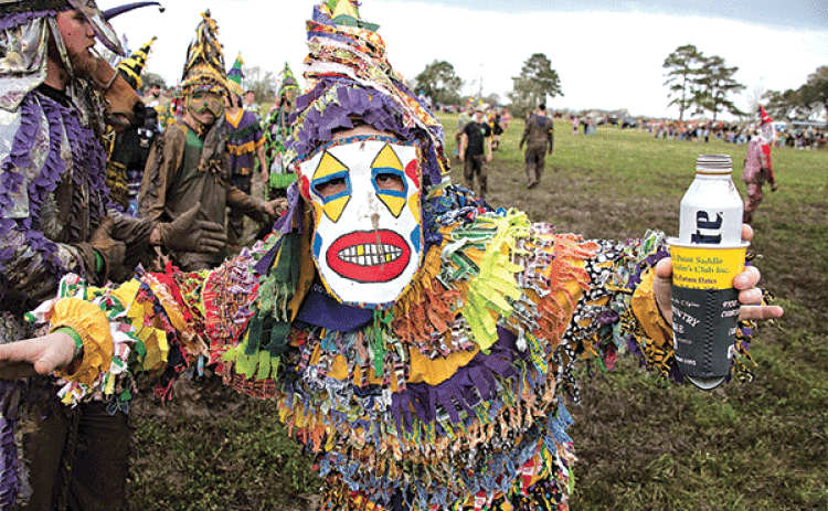 A Mardi Gras runner poses for a photo by David Simpson during the  Church Point Courir de Mardi Gras on Feb. 23, 2020.
