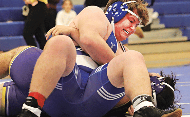 The Blue Jay Wrestling Club hosted a dual meet on Jan. 8 with Opelousas Catholic and Rayne High School. Through this meet they were able to gain more experience and prepared to travel to South Beauregard this weekend.  Charles Sonnier wins his match. (Photo by Amy Myers)