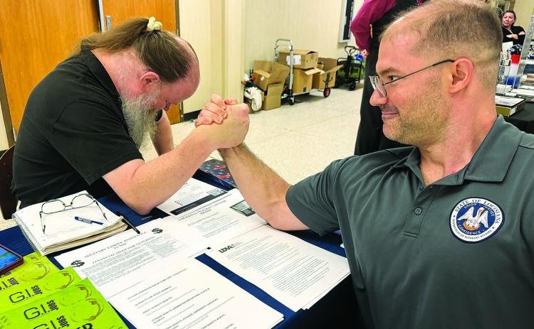 Veterans Marine Paul Ganucheau and Joseph Zetty of the Air Force participate in a little “sibling rivalry” at Vet Fest.